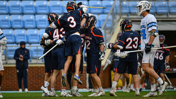 The Virginia men's lacrosse team celebrates after scoring a goal against North Carolina at Dorrance Field in Chapel Hill.